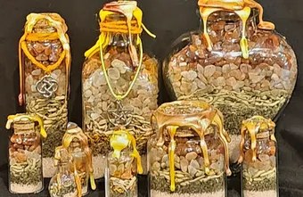 Happiness spell jars: a group of yellow and amber jars