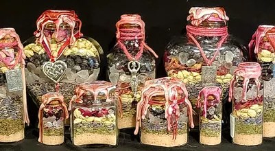 Love spell jars: a group of pink-wrapped jars