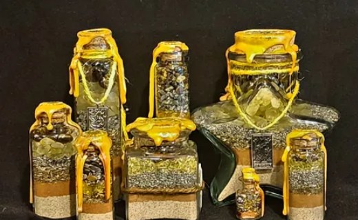Success spell jars: a group of yellow-wrapped jars